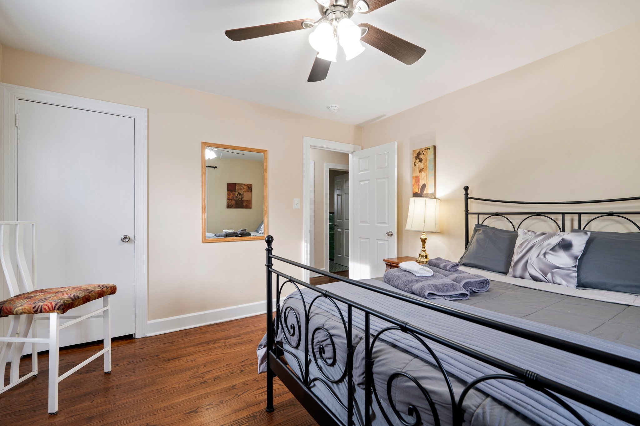 Bedroom featuring a decorative metal bed frame and soft lighting.