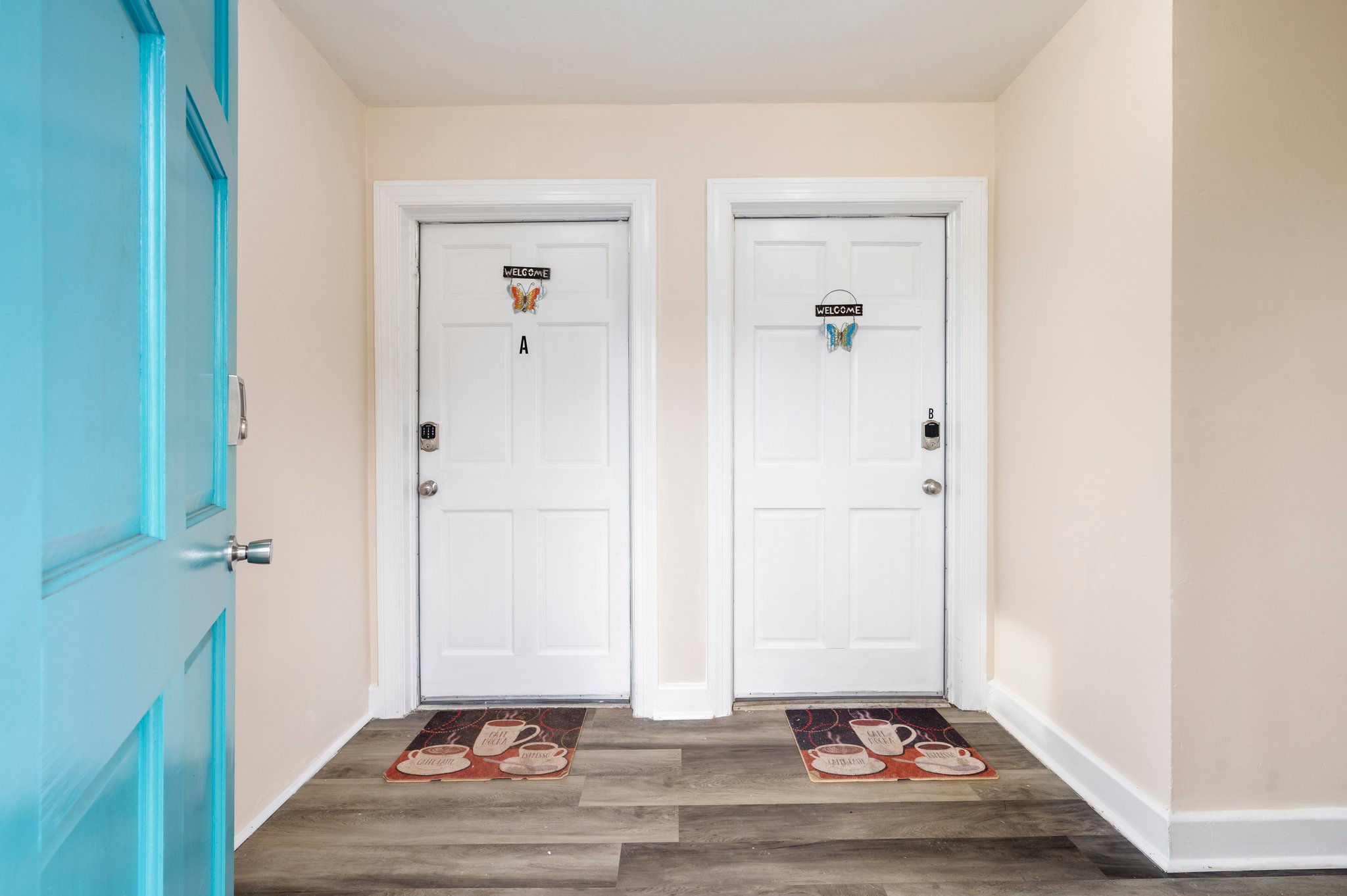 Entryway of duplex leading to two separate doors labeled A and B.