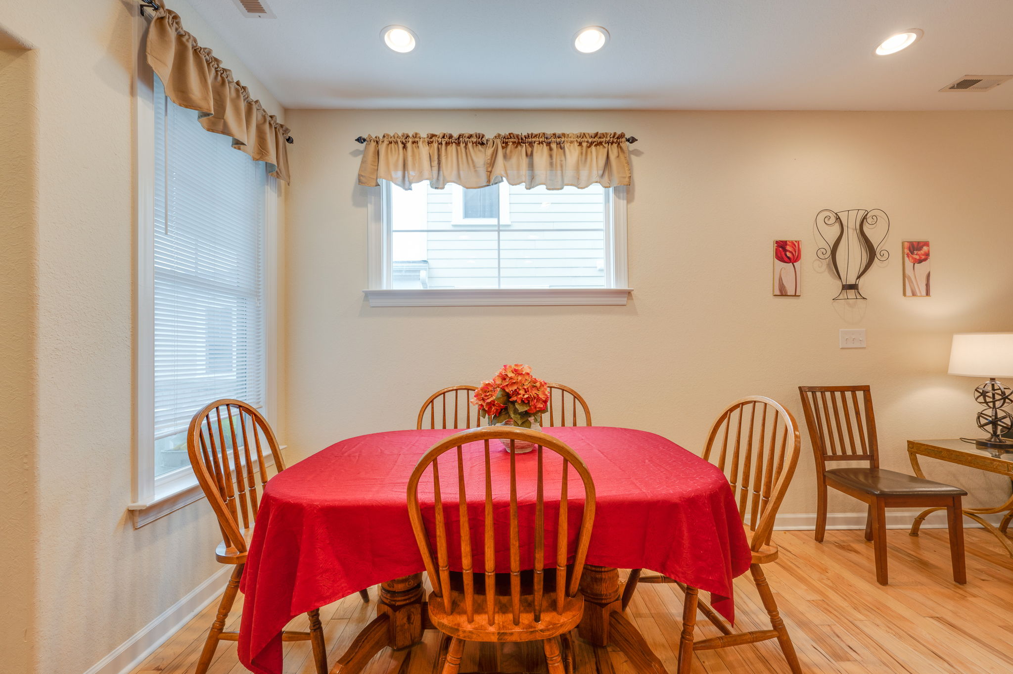 Elegant kitchen with wooden cabinetry, granite countertops, and stainless steel appliances.