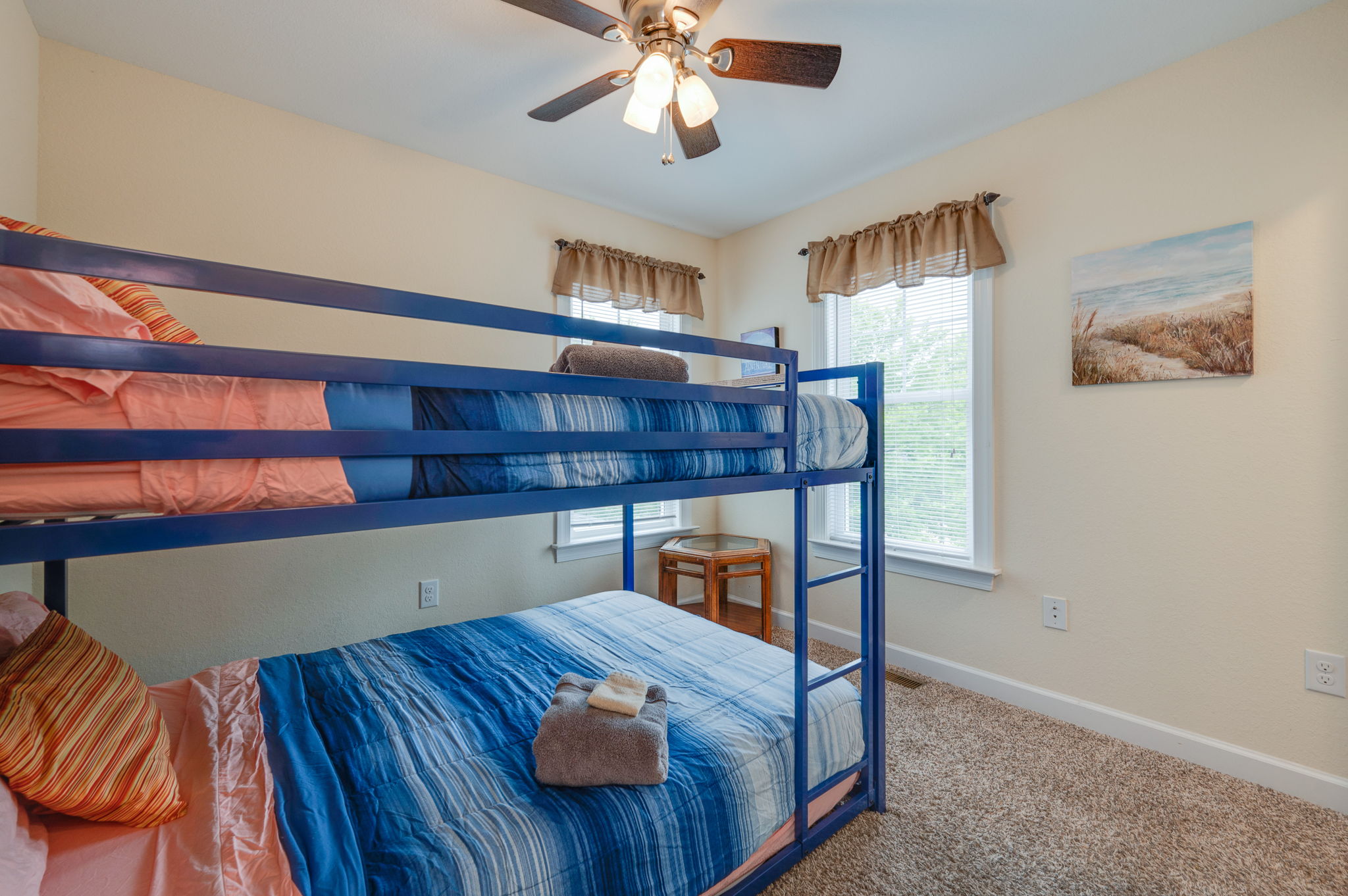 Bunk bed room with cozy bedding, perfect for children or extra guests.