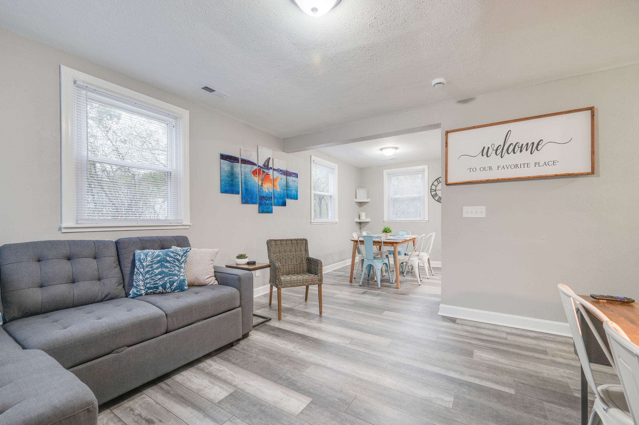 Open-concept living and dining area with a stylish modern decor.