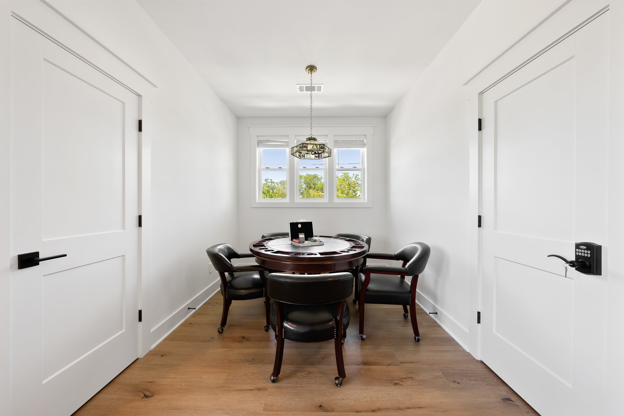 Poker Room with Classic Round Table and Leather Chairs