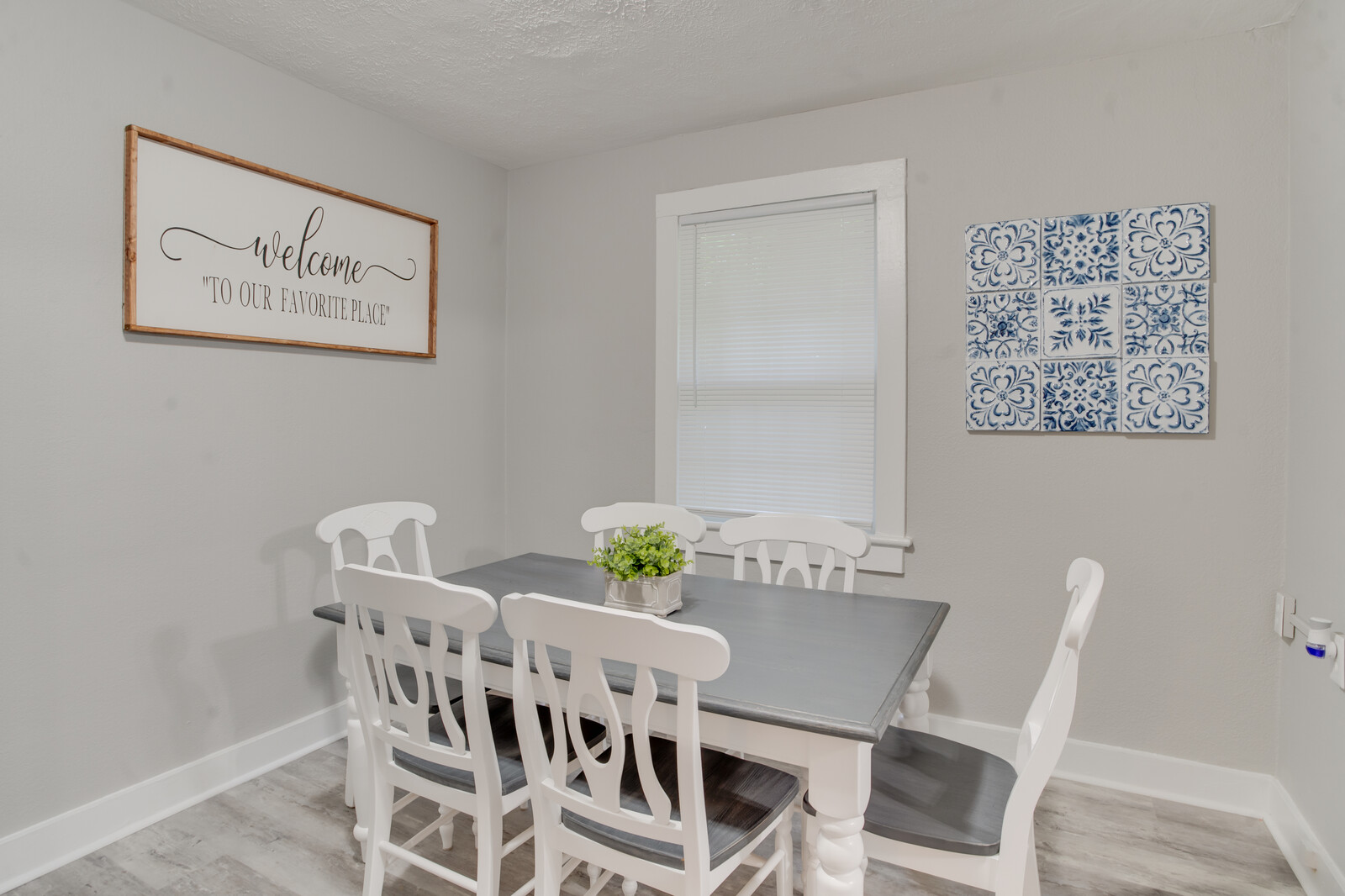 Stylish dining space with decorative wall art and a cozy ambiance
