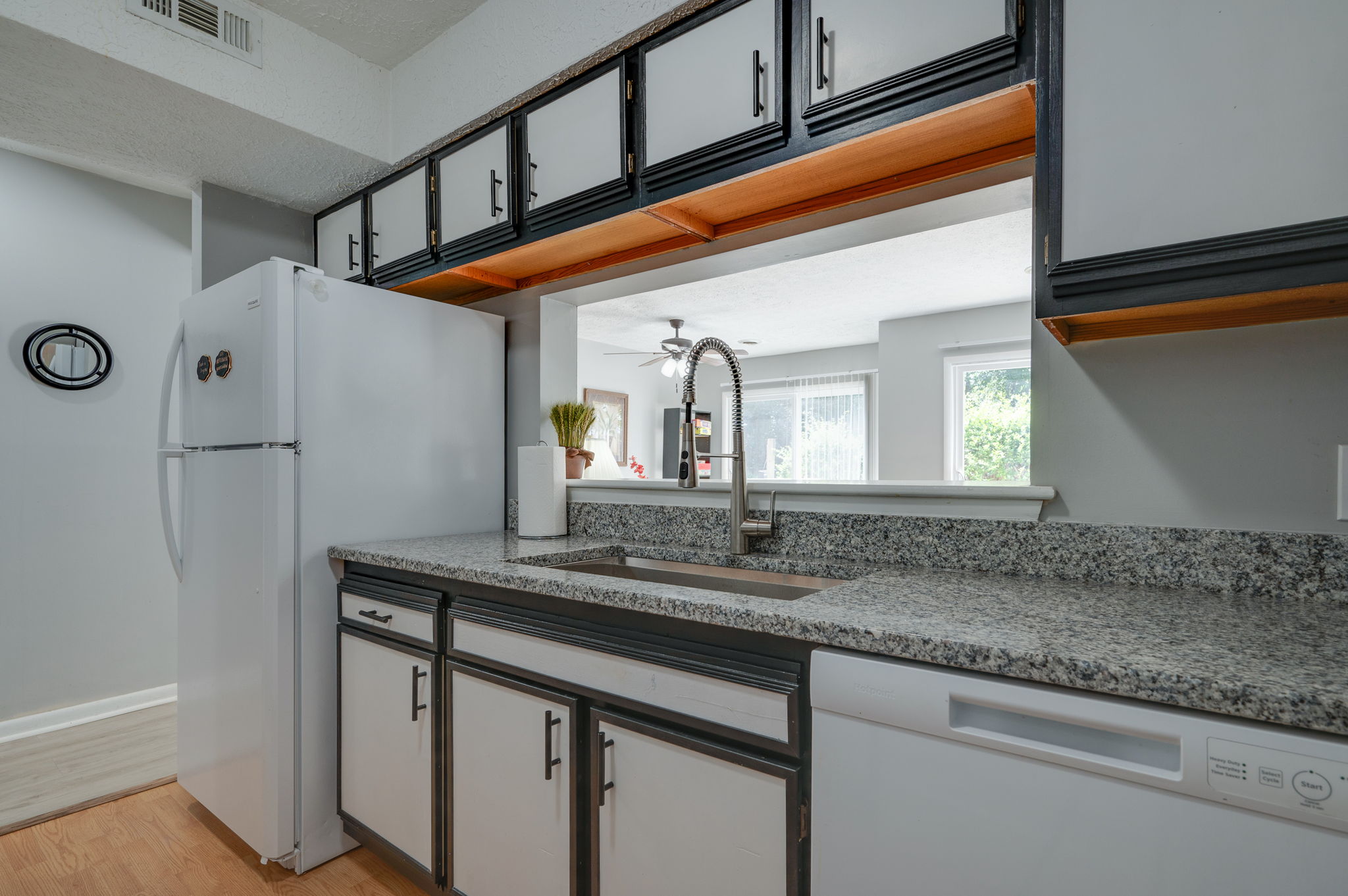 Open kitchen view with breakfast bar and stainless steel sink