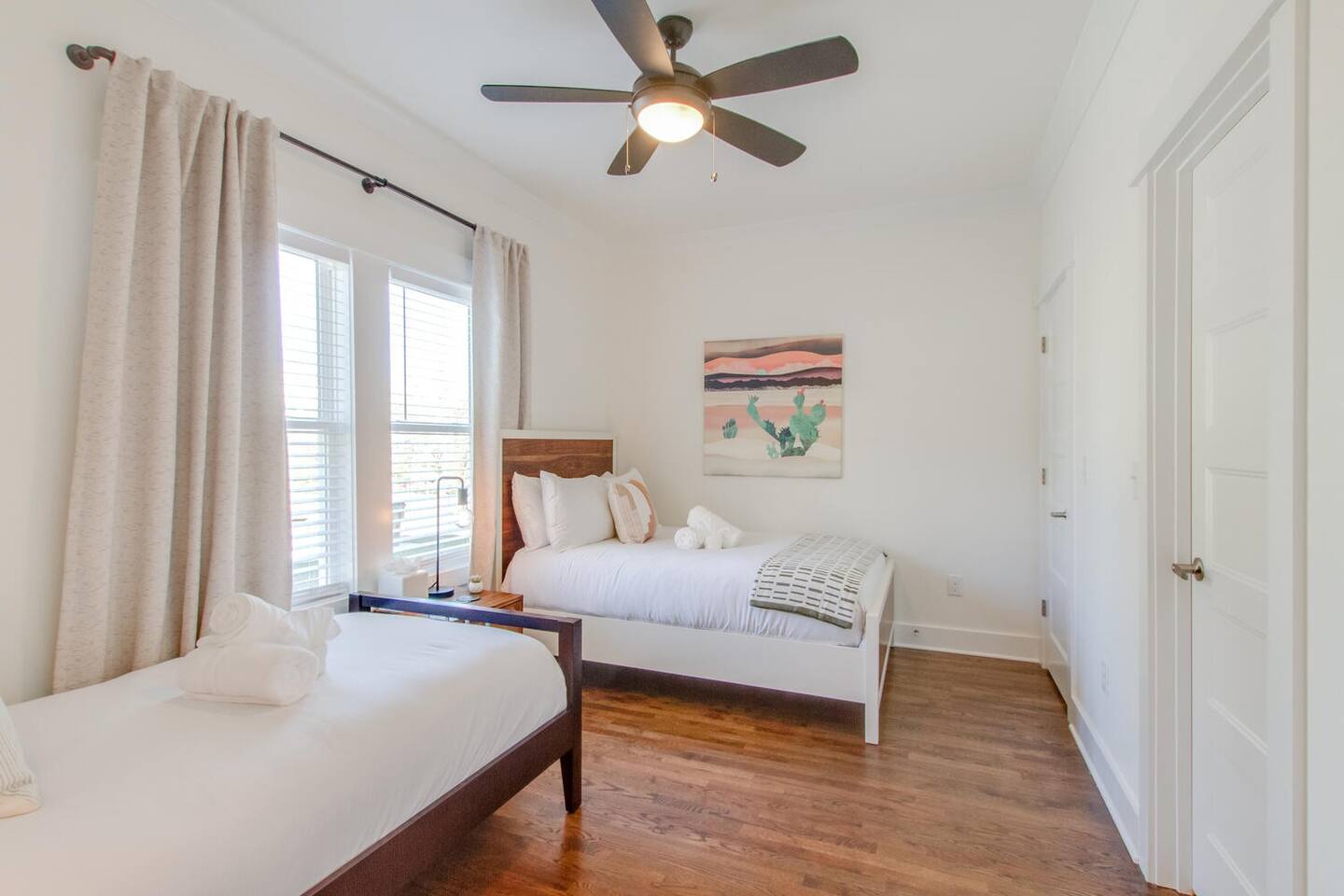 Stylish bedroom with two twin beds and modern decor