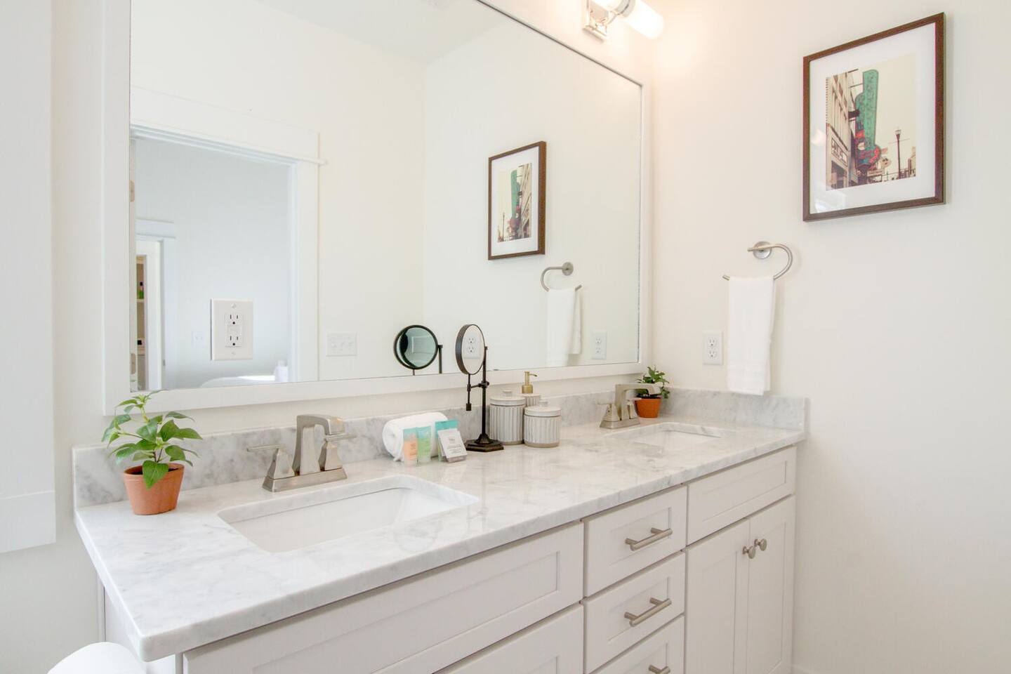 Bright and stylish bathroom with dual sinks and marble vanity