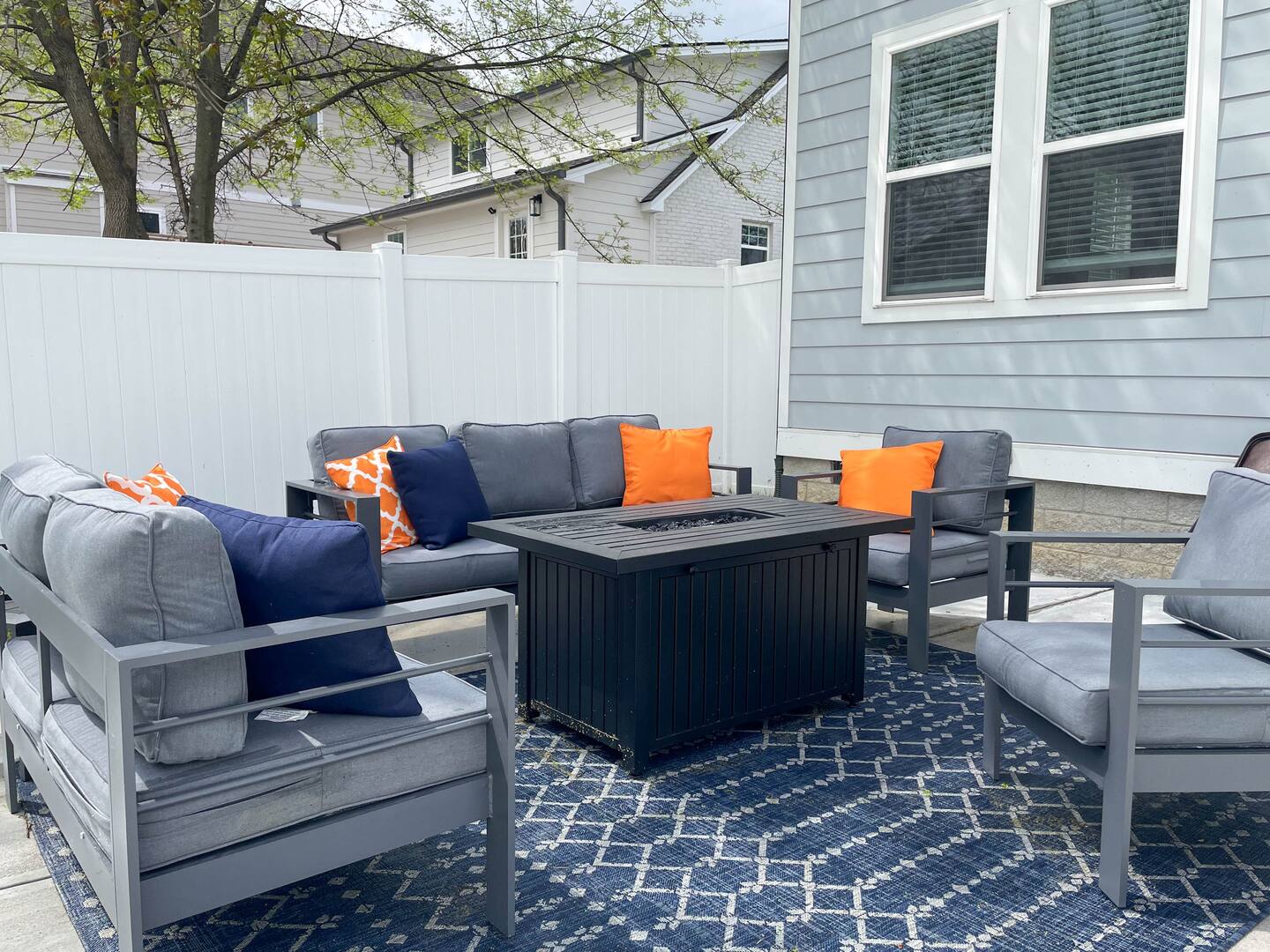 Inviting outdoor lounge area with a modern sectional and colorful pillows