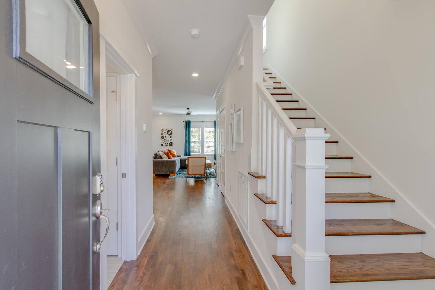Inviting entryway with staircase leading to the upper floor