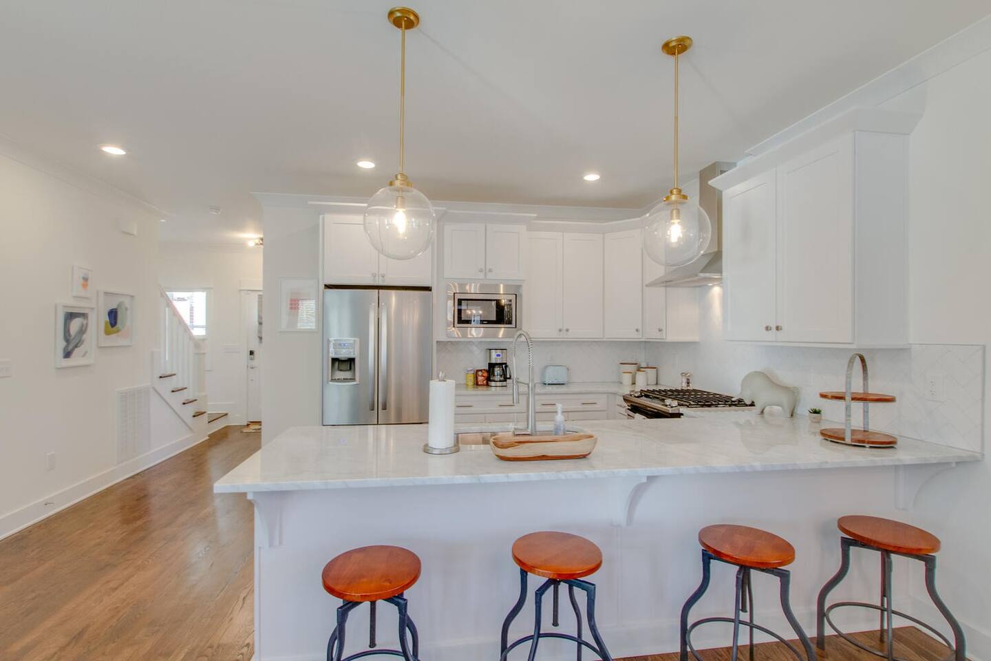 Bright and airy kitchen with white cabinets and modern appliances