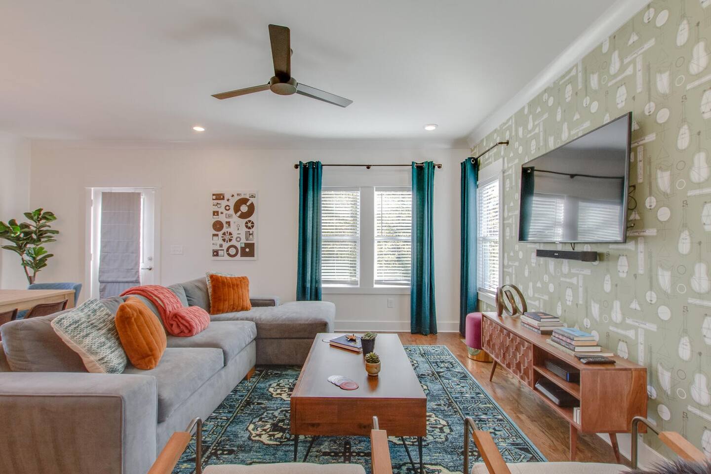 Cozy living room with a mounted TV and accent wallpaper