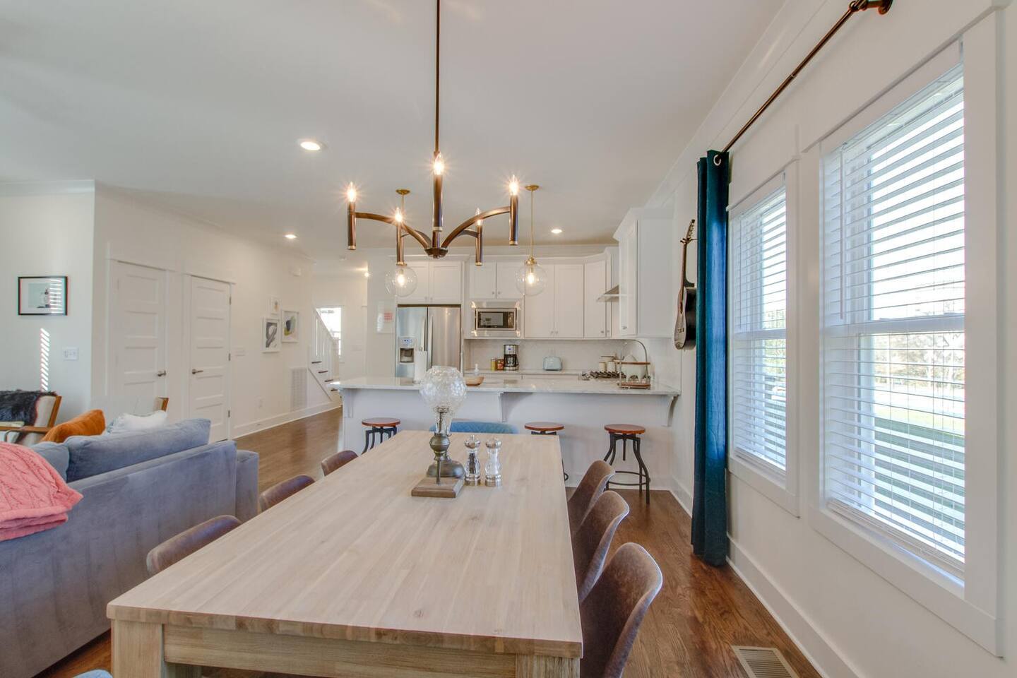 Elegant dining area with a wooden table and statement lighting