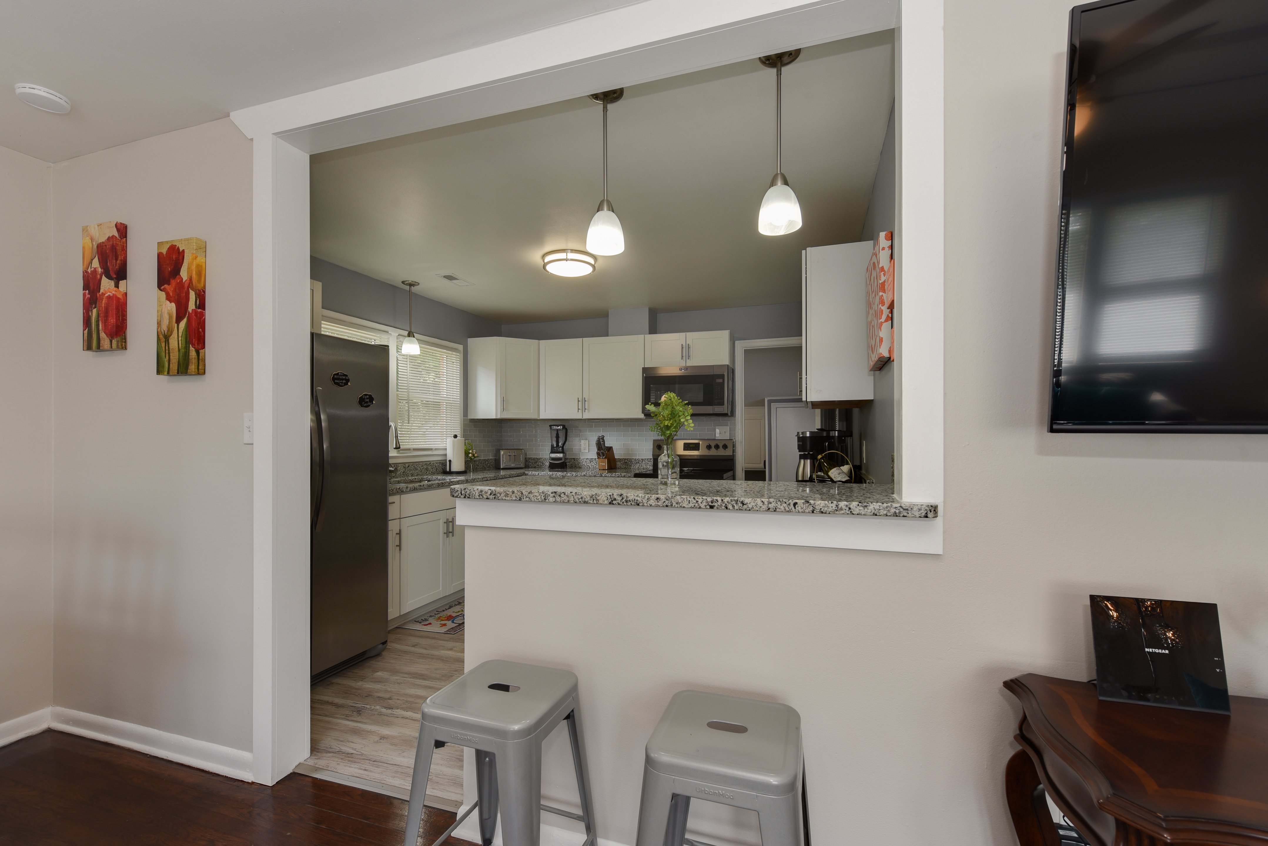 Modern kitchen with stainless steel appliances and white cabinets