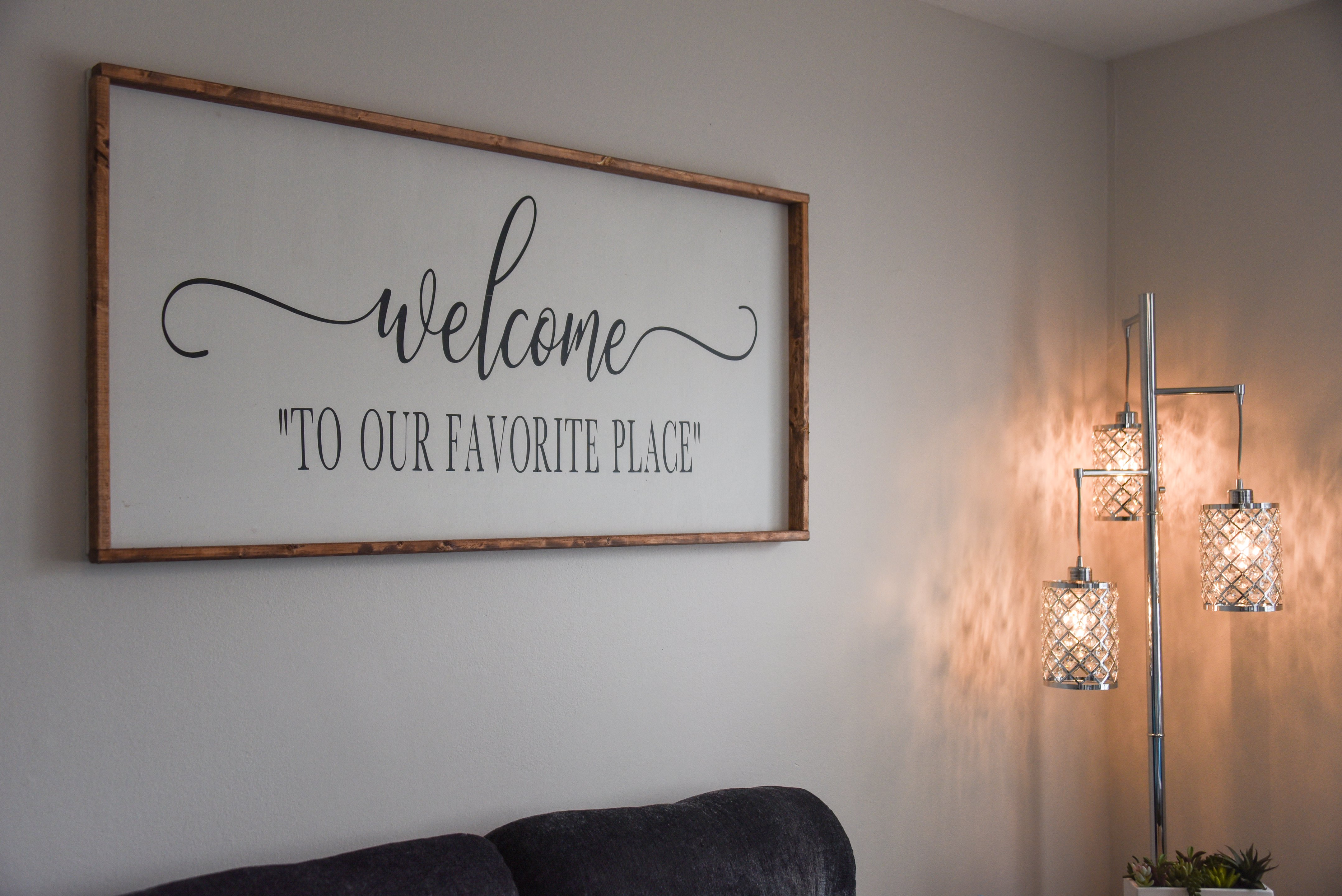 Decorative wall sign with warm lighting in the living room