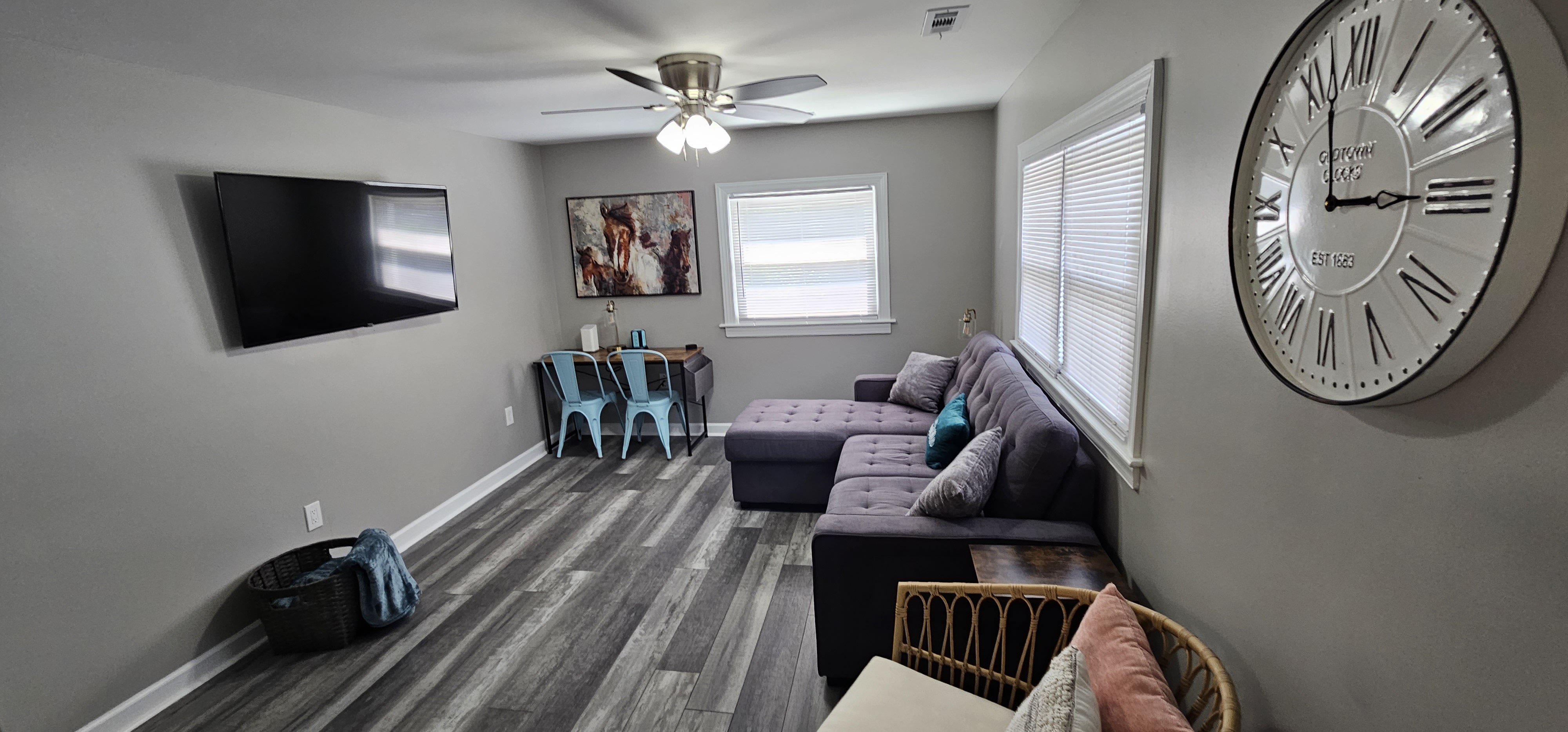Cozy living room with sectional sofa and mounted TV