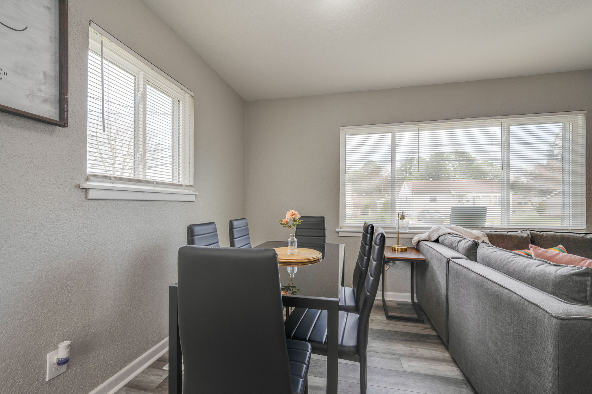 Modern dining space with large windows and natural lighting