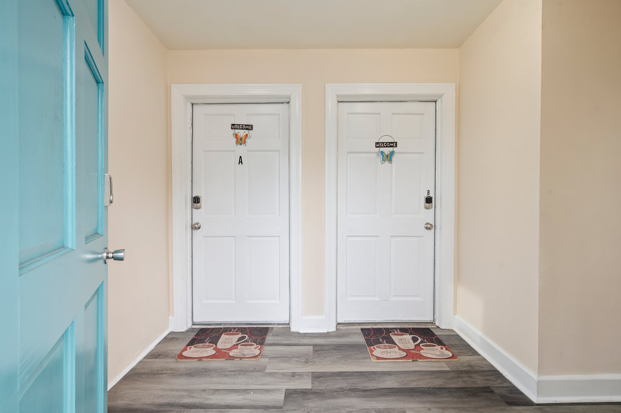 Entryway of a duplex with two separate unit doors labeled A and B.
